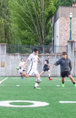 Soccer players on Stott Field