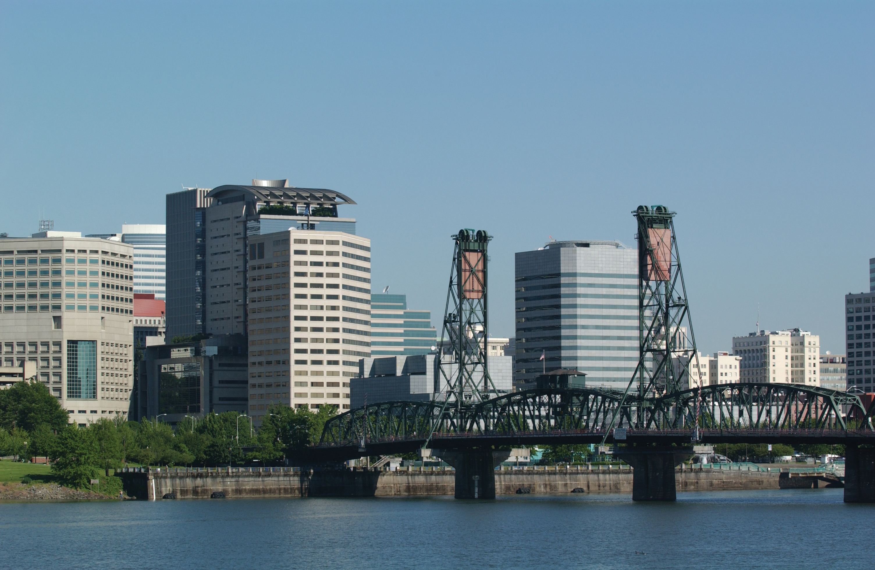 Portland skyline with Hawthorne Bridge and Willamette River in foreground
