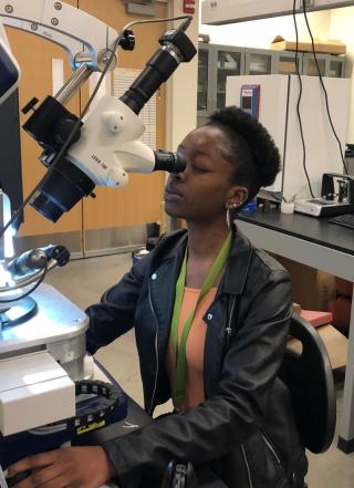 REU 2019 participant Chelsea Morand in lab