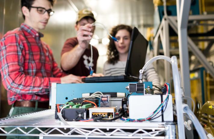 Researchers working with electronics.