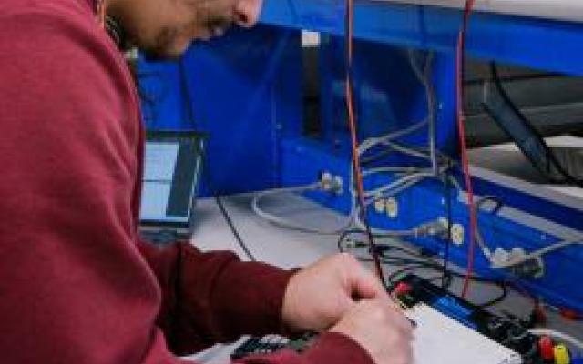 Student working in experimental physics