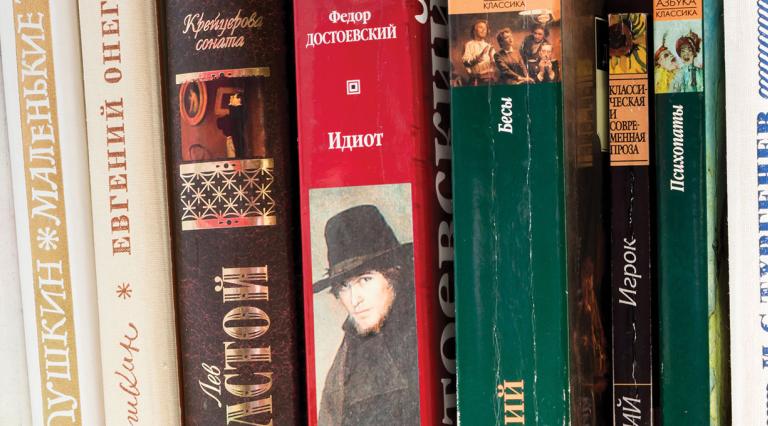 A shelf with books of the great Russian writers of the classics: Pushkin, Lermontov, L. Tolstoy, F. Dostoevsky, A. Chekhov
