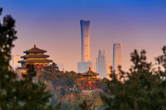 Sunset Beijing cityscape between ancient chinese architecture. historic buildings and Beijing modern building with sweet sun rise sky, Beijing, China