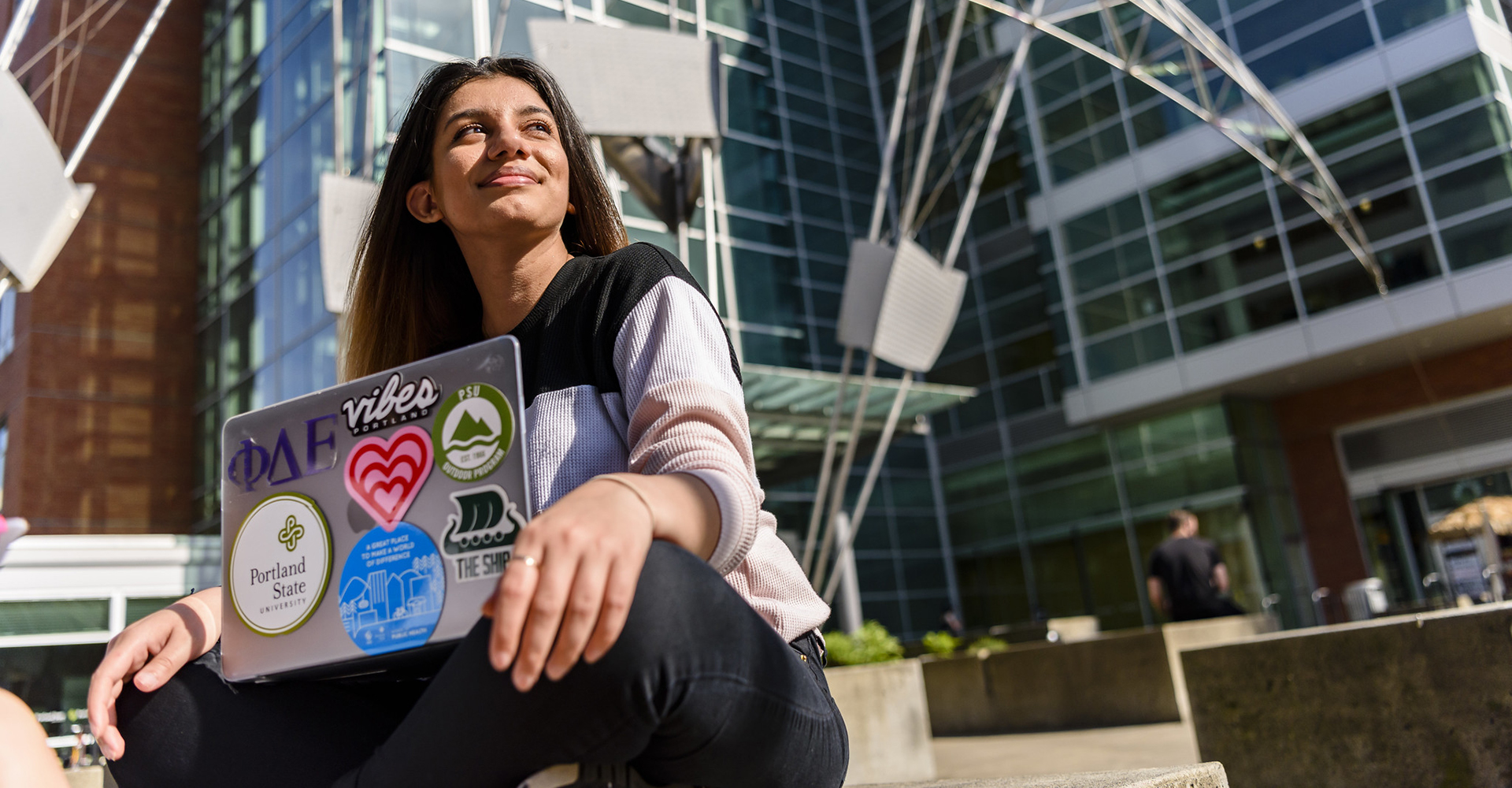 student sitting with laptop