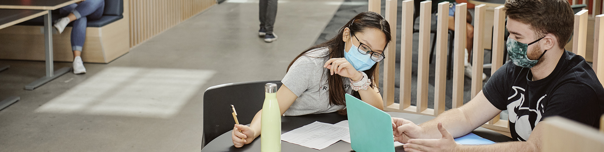 two PSU students studying together