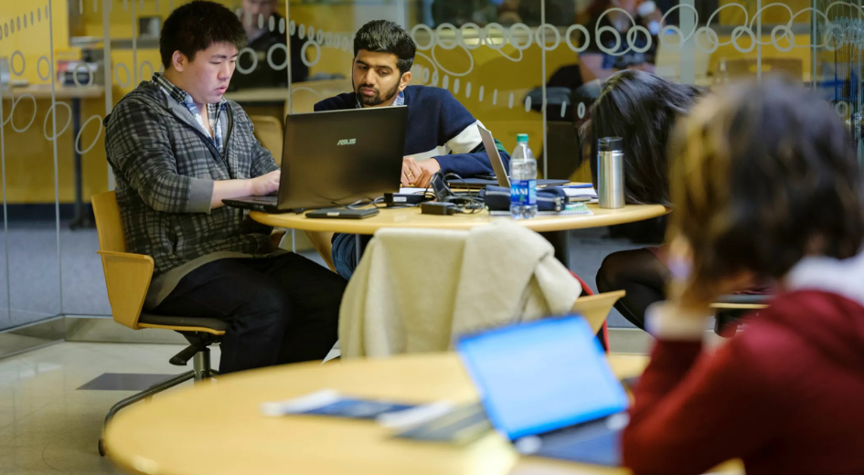 students studying with laptops