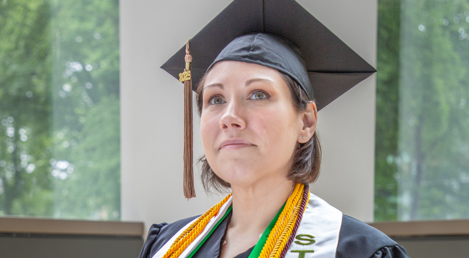 Brandi Swiderski pictured in commencement attire