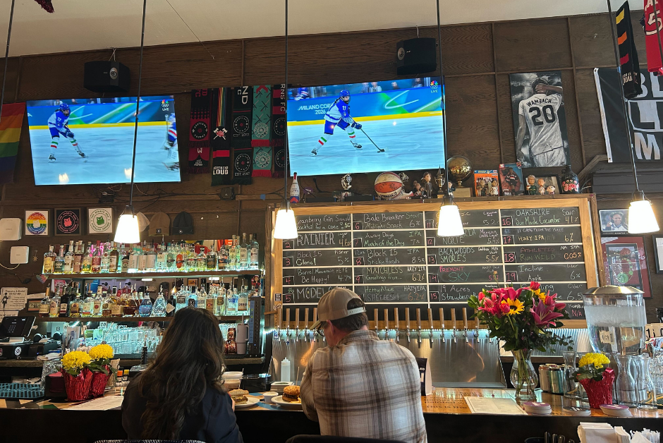 parons watching women's hockey game at the Sports Bra