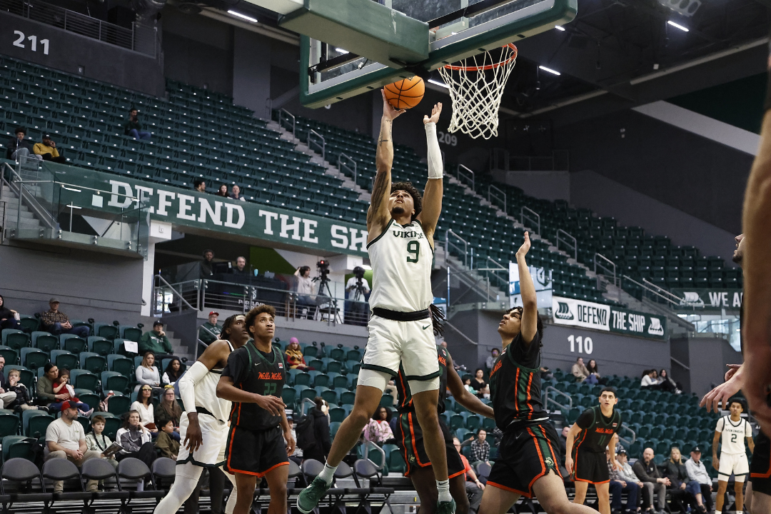 Isaac Brice shoots a basket