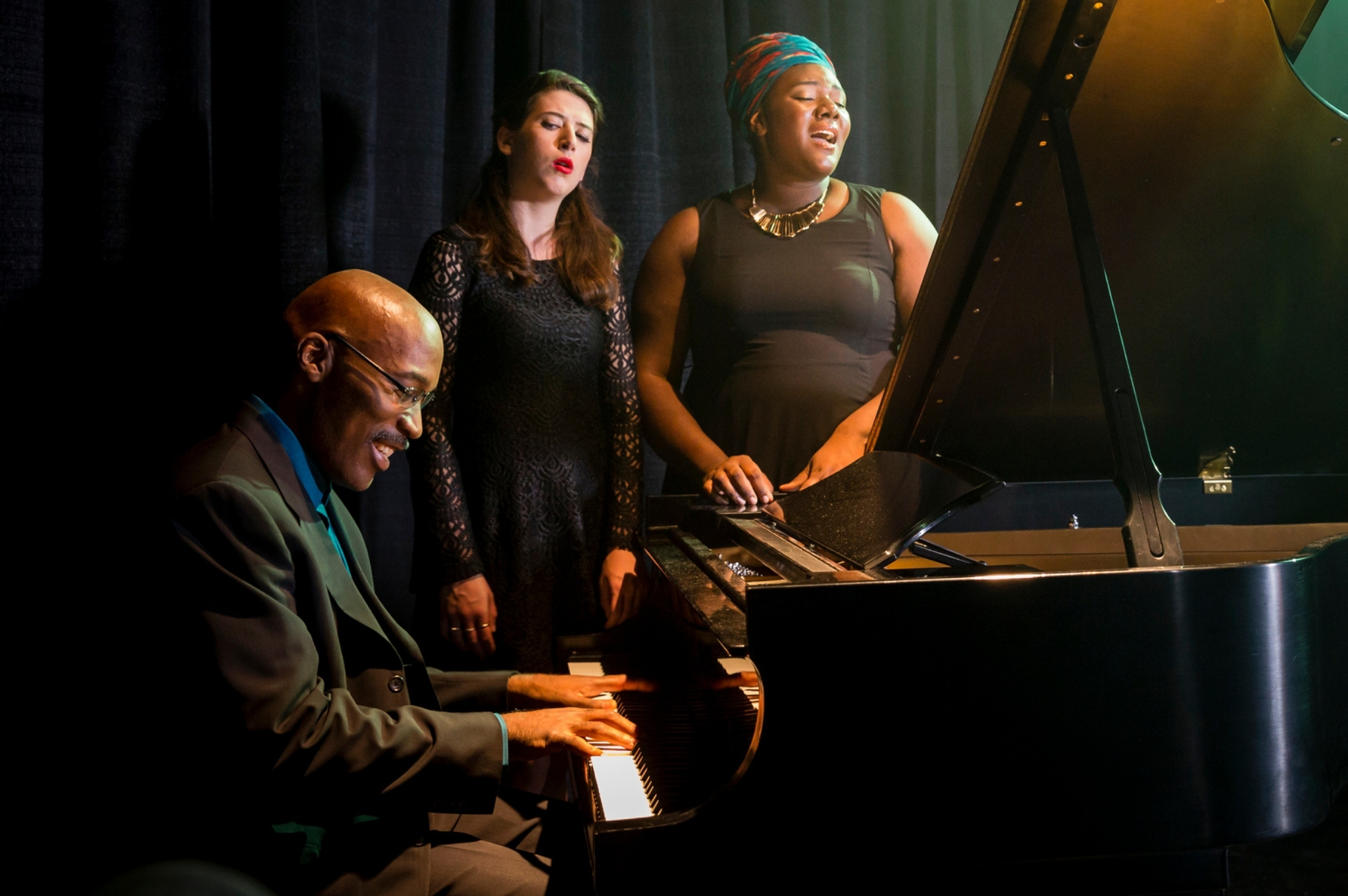 Darrell Grant playing jazz piano with PSU voice students