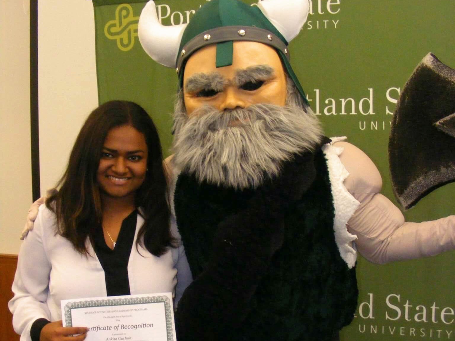 The image is of Ankita standing next to Victor E. Viking.