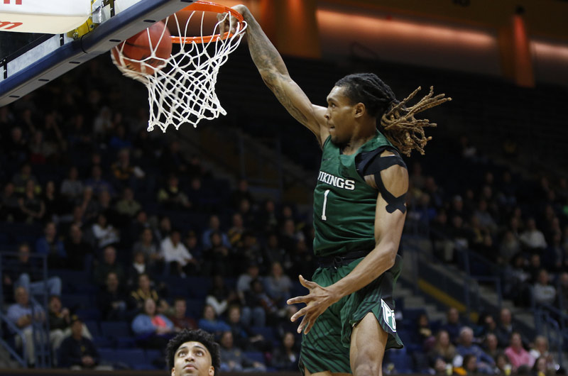 Vikings Men's basketball player making a basket