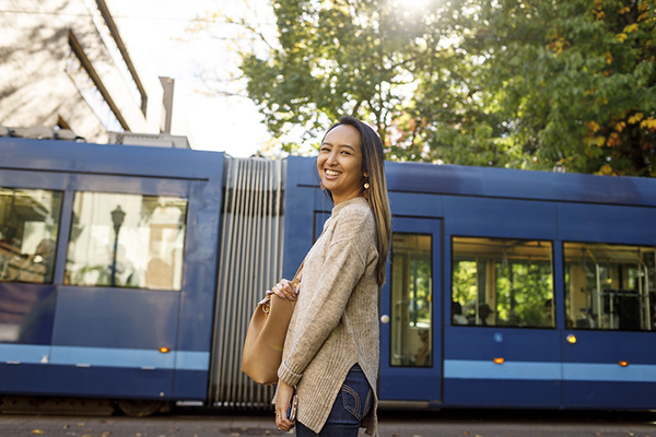 student waiting to board the Portland Street Car