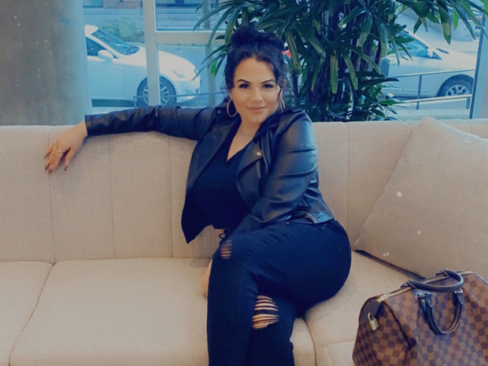 There is a person sitting on a couch.