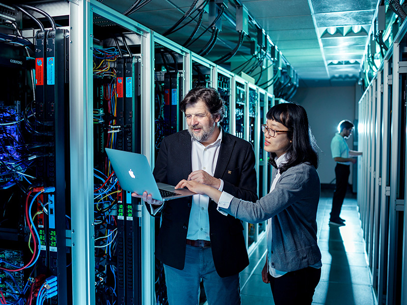 PSU professor and doctoral student working in the computer server room