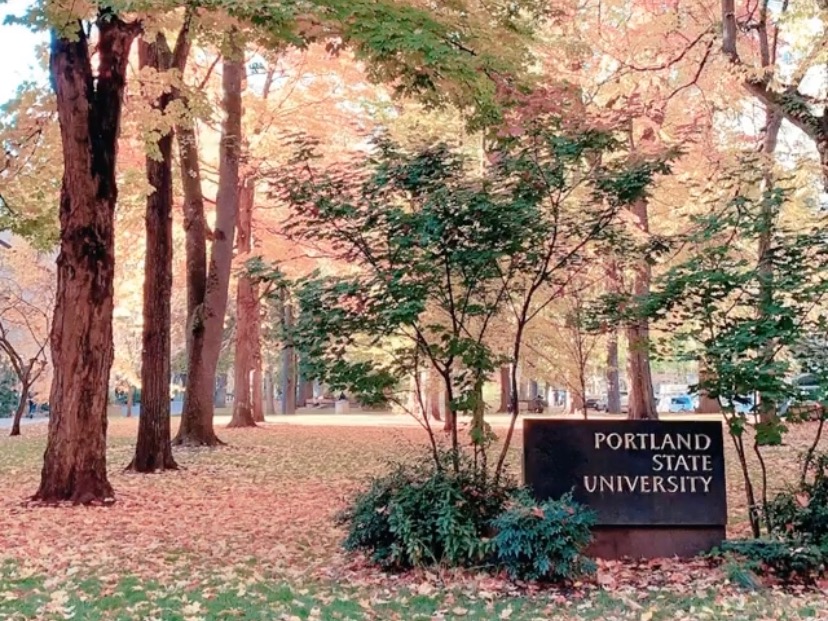 There is a Portland State University sign in the Park Blocks.