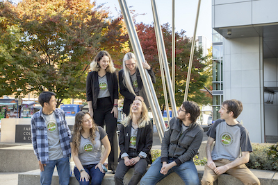 group of students smiling and wearing Portland State Aerospace Society t-shirts