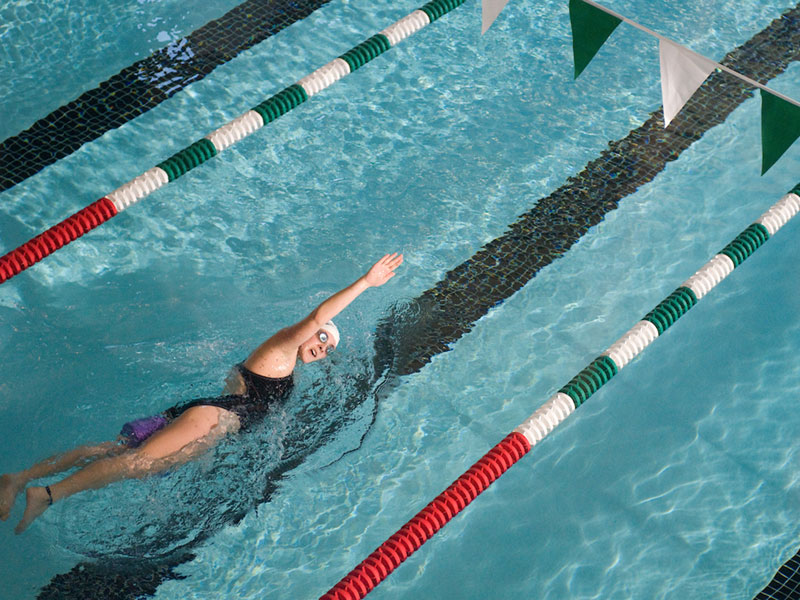 student swimming in Campus Rec pool