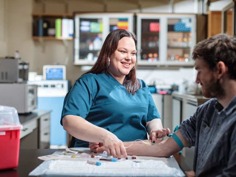 PSU health care student working with a patient