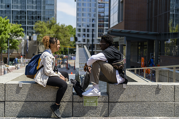 students relaxing in Urban Plaza