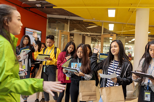 students being led on a campus tour by a student ambassador