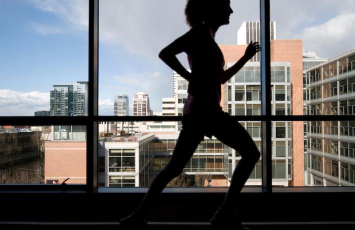 psu public health student running on an indoor track