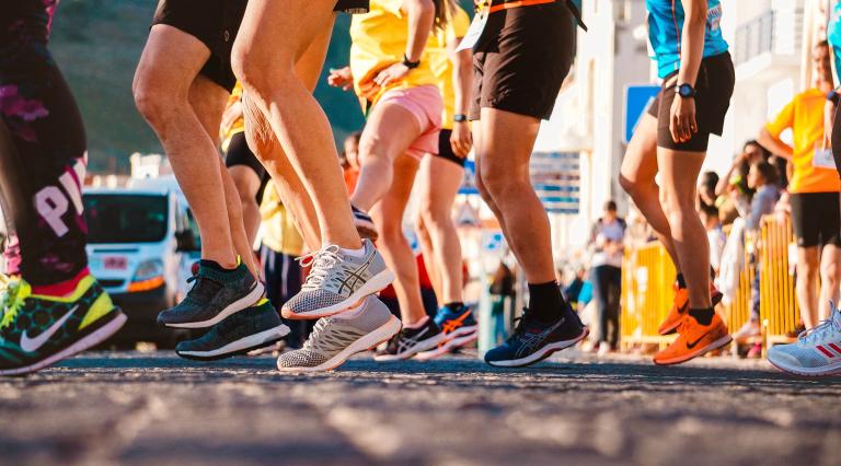 Runner legs and feet as they prepare for run