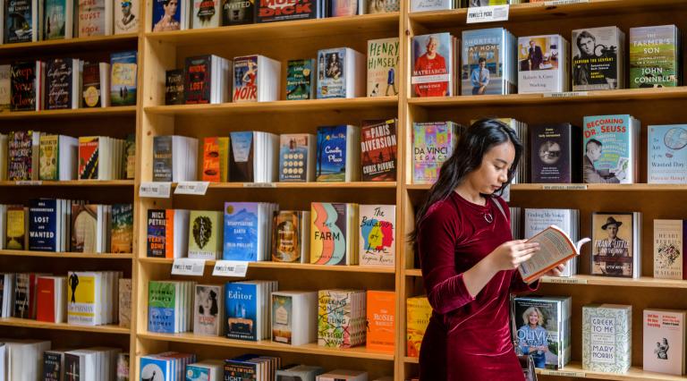 Student looking at books