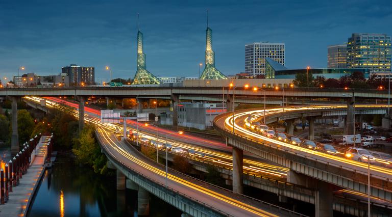 Portland highways at dusk with cars driving by.