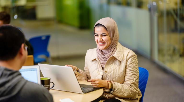 portland state university International and Global Studies: International Development student working on her computer