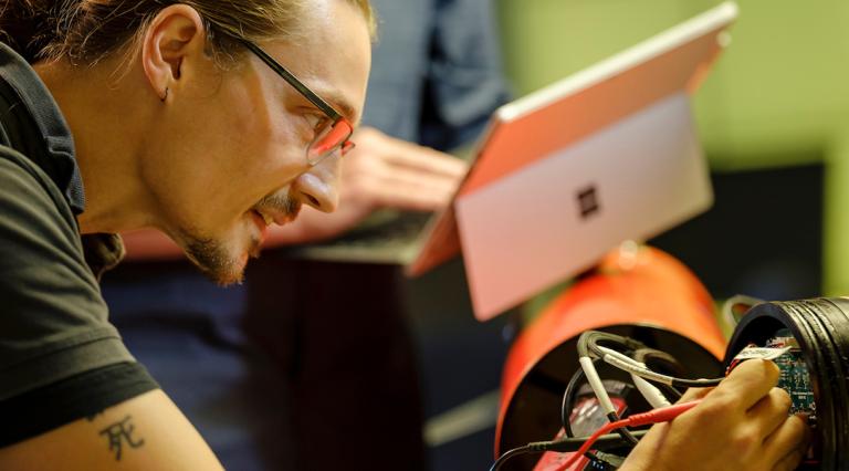 PSU electrical engineering student working on a project
