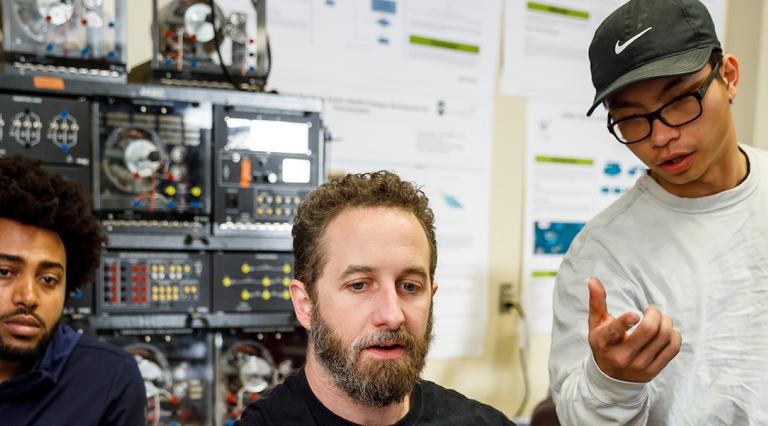 PSU graduate students working in a lab
