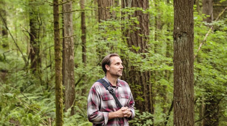 PSU environmental management student walking in the woods