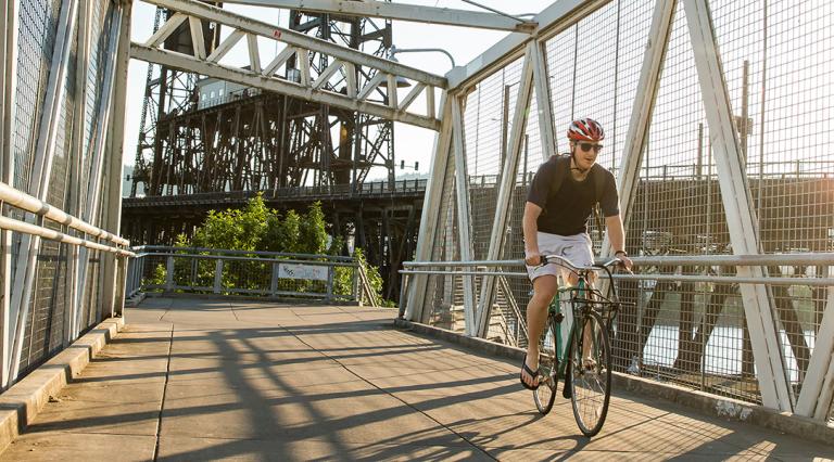 PSU student riding on a bike path