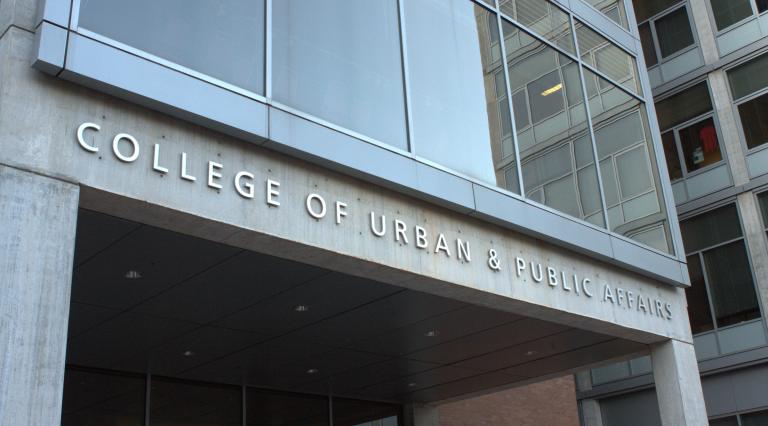 Outside of College of Urban & Public Affairs building sign