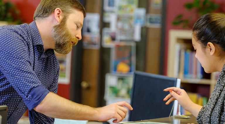 Customer service person helping a student