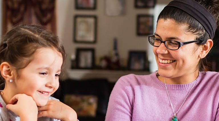 Counselor meeting with a child and their parent