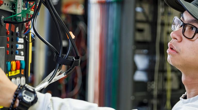 Student working on a computer server