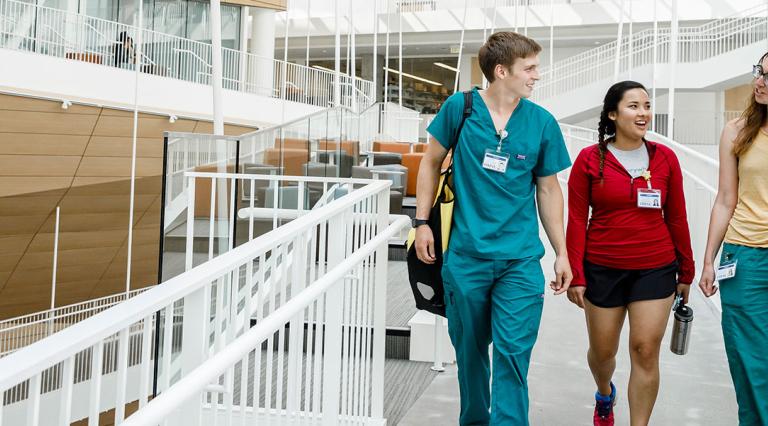 Doctors and nurses walking through a hospital