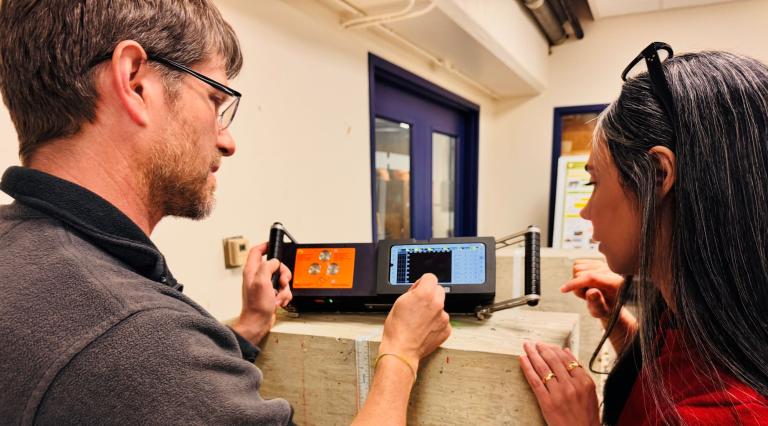 professor and student testing cement