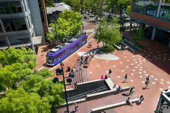PSU Sociology Undergraduate Aerial View of PSU Urban Plaza on sunny day with streetcar
