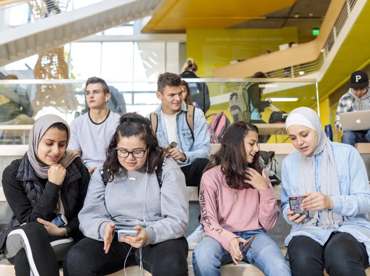 Students gathering in Karl Miller Center atrium