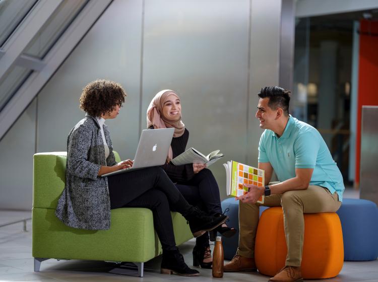 Diverse group of students studying together