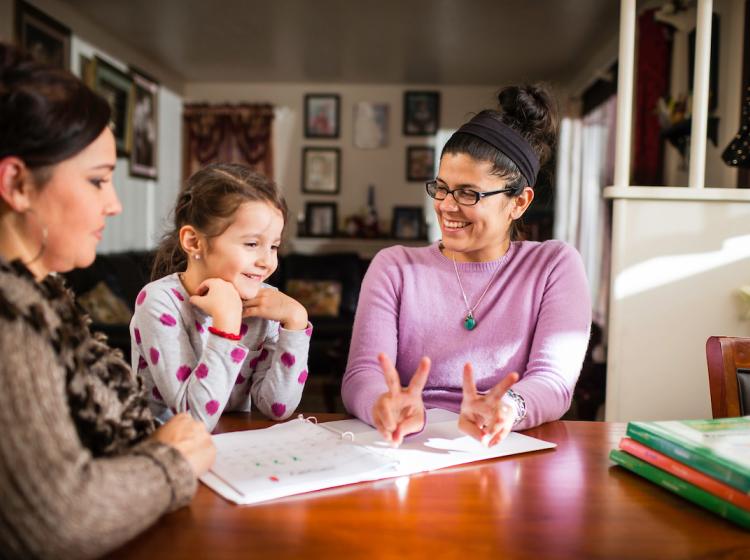 Student working with a family