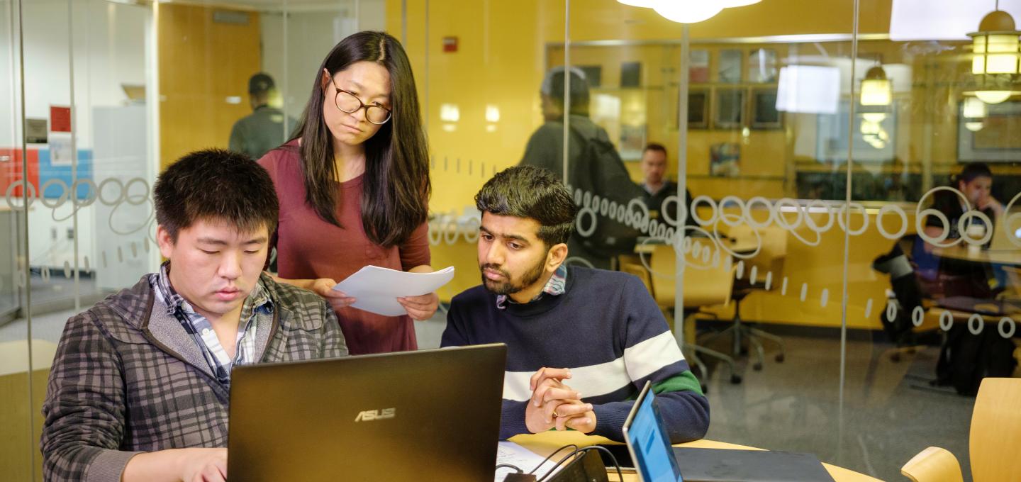 students looking at a computer