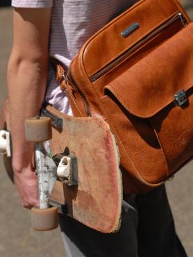 Student with backpack and skateboard