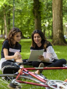 Two PSU students studying together on the grass in the South Park Blocks