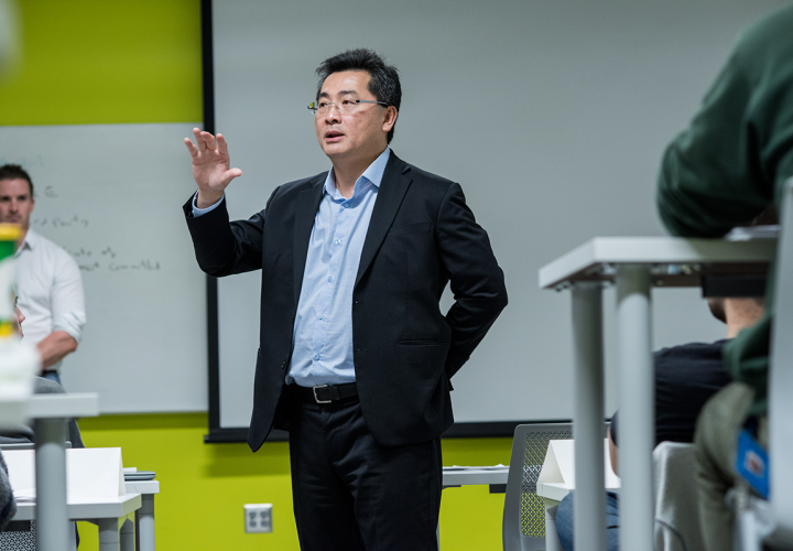 Man teaching in green classroom