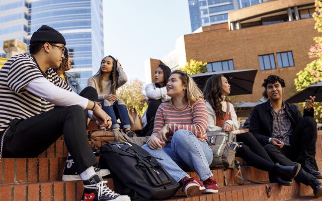 Students sitting in Urban Plaza