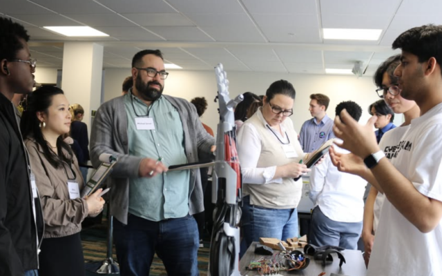 Students presenting their work at competition